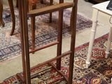 two chairs and a table in a room with a rug