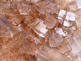 crystal on a white plate with a small amount of crystals in it