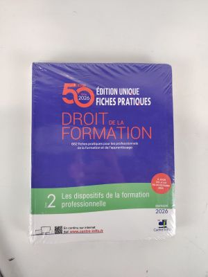 the book is on a white table with a black pen