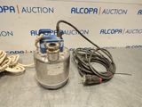 a metal tank with a hose attached to it sitting on a table