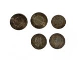 four different types of coins are shown on a white surface