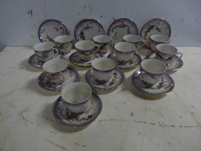 a lot of cups and saucers on a table
