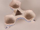 a small blue and white bowl with a triangle on it