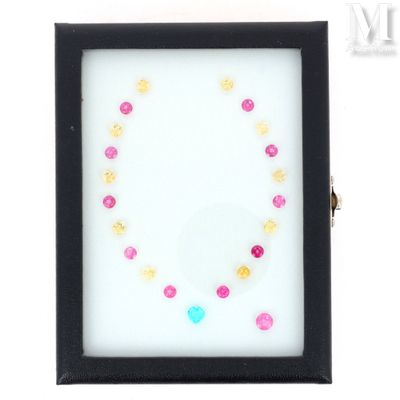 a close up of a picture of a black frame with a pink and yellow bead