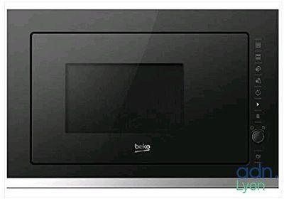 the microwave is black and silver in color and has a built in grill
