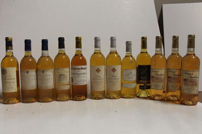 several bottles of wine are lined up on a table