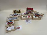 many different types of toy vehicles in boxes on the table