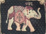 an image of a tapestry with a picture of an elephant on it ' s back
