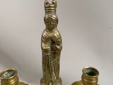 brass candlesticks with a statue of a woman holding a candle