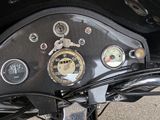 a close up view of a motorcycle dashboard with gauges