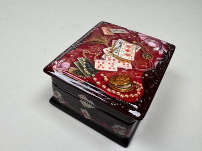 a small box with a picture on it on a table