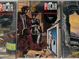 three comic books are sitting on a table in front of each other