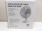 an image of a box of a desk fan on a table