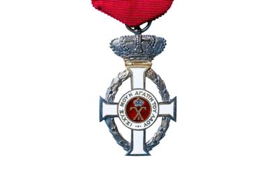 an image of a medal with a red ribbon on it