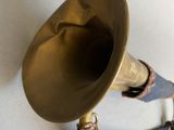 a small purse with a brass horn attached to it