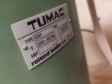 a close up of a green drum with a label on it