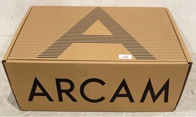 a cardboard box with the word arcam written on it