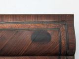 a close up of a wooden shelf with a clock on top of it