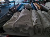 many towels on a table in a room