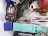 a pile of assorted items in a plastic container