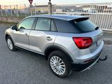 the rear end of a silver volkswagen suv parked in a parking lot