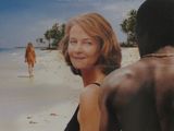une affiche représentant une femme et un homme sur la plage