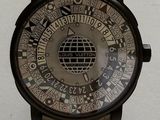 a watch that is on display on a white surface