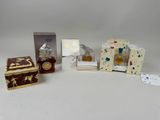 several different types of perfumes and boxes on a white surface