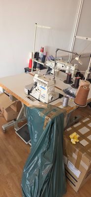 a sewing machine sitting on a table in a room