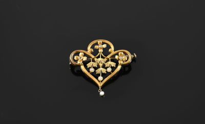 a gold and pearl broochle