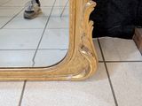 a mirror that is sitting on the floor in a room