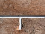 a close up of a piece of wood with a white line