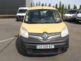 a yellow and black van parked in a parking lot