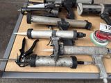 many different types of air guns on a table