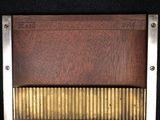a picture of a close up of a wooden comb