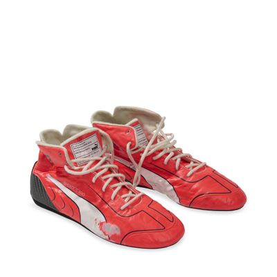 red puma sneakers with white laces and black soles