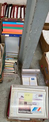 many boxes of books and other items on the floor