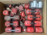 a box full of red and black fire extinguisors and hoses