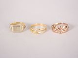 three different types of rings on a white surface