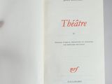 a book opened to show a picture of a man in a suit
