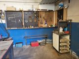 an image of a work room with tools on the wall