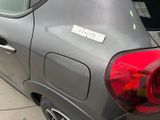 a car that has a sticker on the back of it
