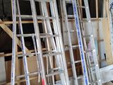 many ladders that are stacked up in a room