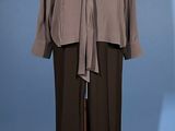 an image of a mannequin wearing a gray shirt and black pants