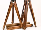 an image of a pair of wooden tripod stands against a white background