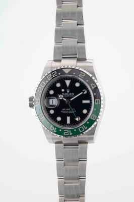 rolex submarine watch with green bezel and black dial