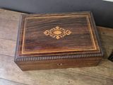 an old wooden box sitting on top of a wooden table