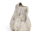 a white vase that is sitting on a white surface
