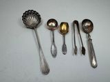 several spoons and spoon spoons are lined up on a table