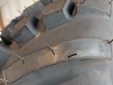 a close up of a motorcycle tire with spikes on it